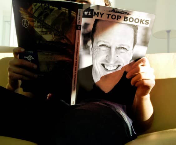 man holding a book with matt bowles in the cover