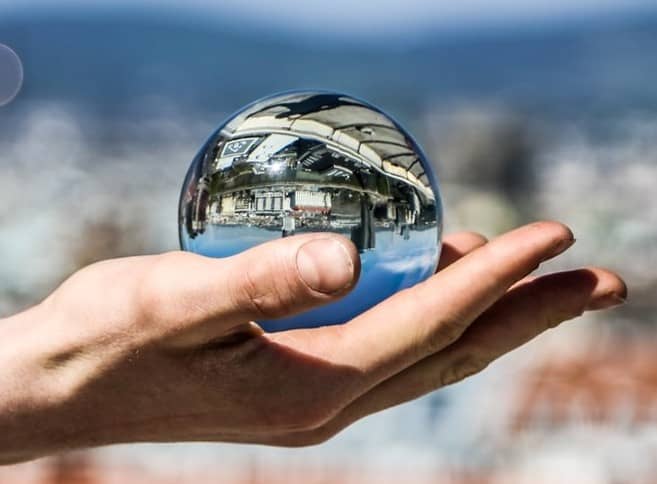 metallic reflective sphere on a hand