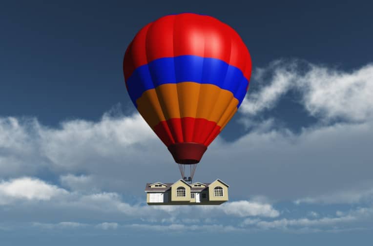 inflated ballon carrying residential house